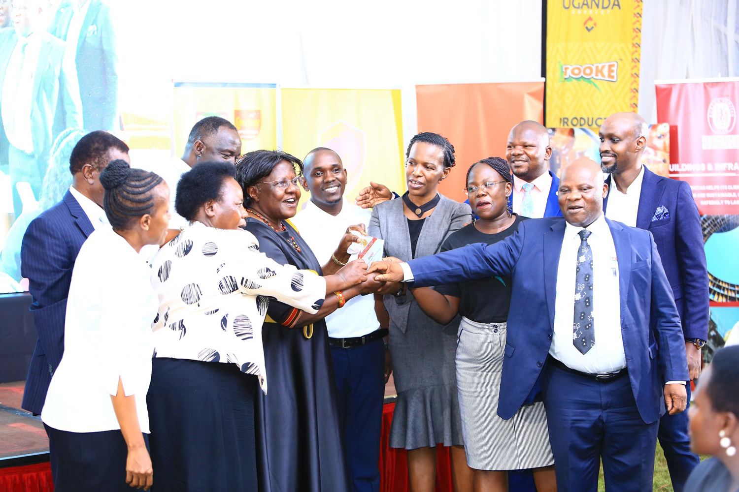 Rev. Prof Florence Mulanga. Executive director for Banana Industrial Research and Development center (BIRDC) celebrating with his team after receiving the East Africa Brand Quality Awards together with Guest Speakers; Dr. Dennis Ngabirano (Psalms Food Industries Ltd), Amb. Sarah Nakate (MEACA) and Mr. Edwin Kabuleeta (Bureau Veritas) Rev. Prof Florence Mulanga. Executive director for Banana Industrial Research and Development center (BIRDC) celebrating with his team after receiving the East Africa Brand Quality Awards together with Guest Speakers; Dr. Dennis Ngabirano (Psalms Food Industries Ltd), Amb. Sarah Nakate (MEACA) and Mr. Edwin Kabuleeta (Bureau Veritas)