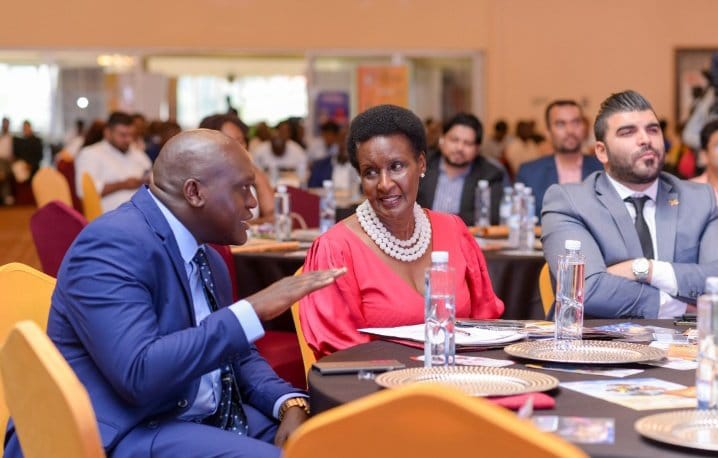 Hon. Amelia Kyambadde having a discussion with Mr. Otim Gilbert of Stabex International at the East Africa Brand Quality Awards gala
